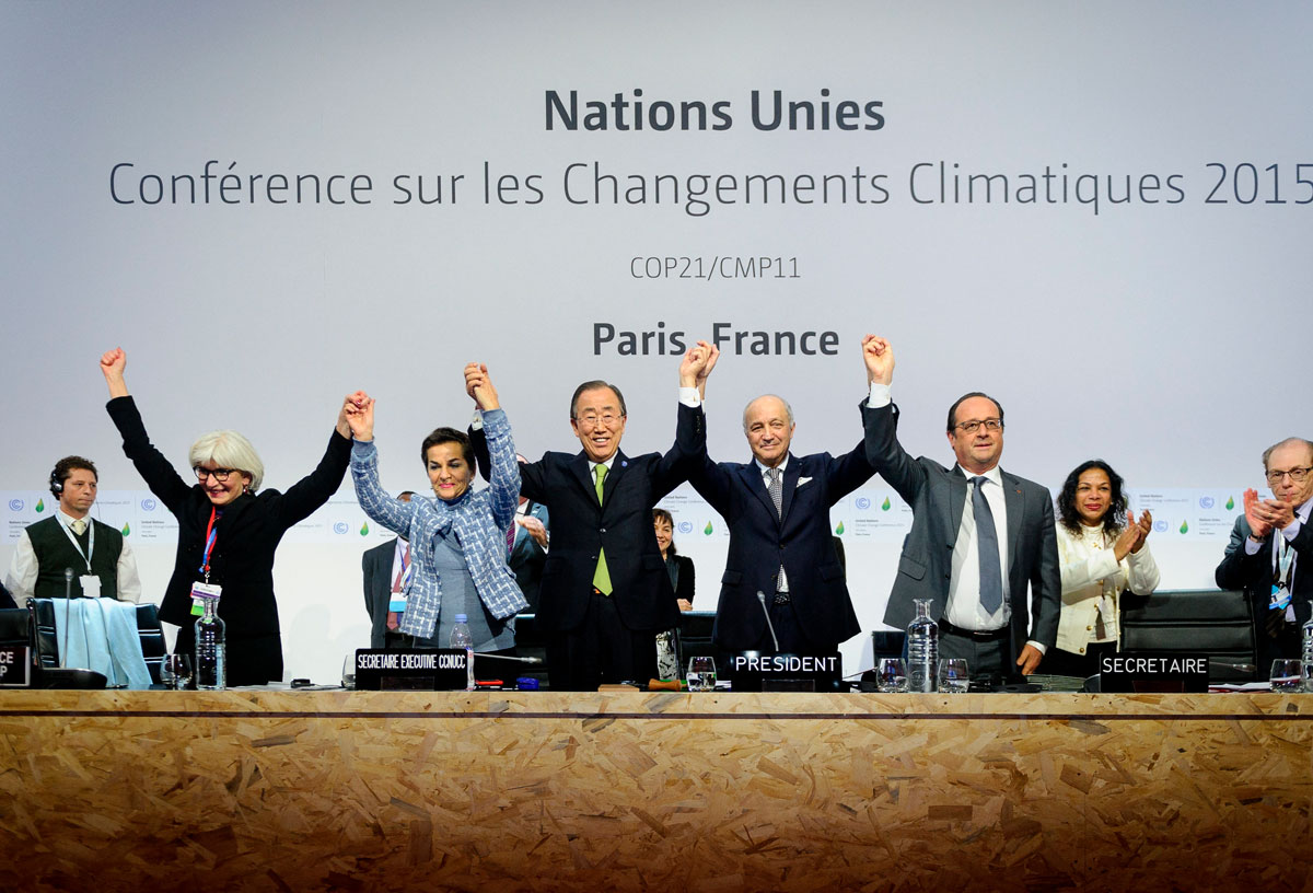 adoption of a historic global warming pact at the COP21 Climate Conference in Le Bourget, north of Paris, on December 12, 2015