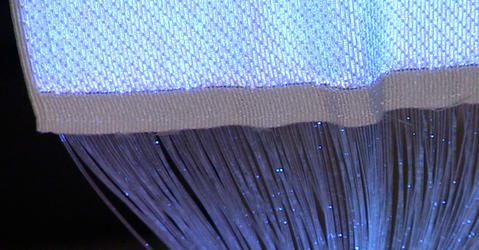 Luminous textile with fiber optics and blue light